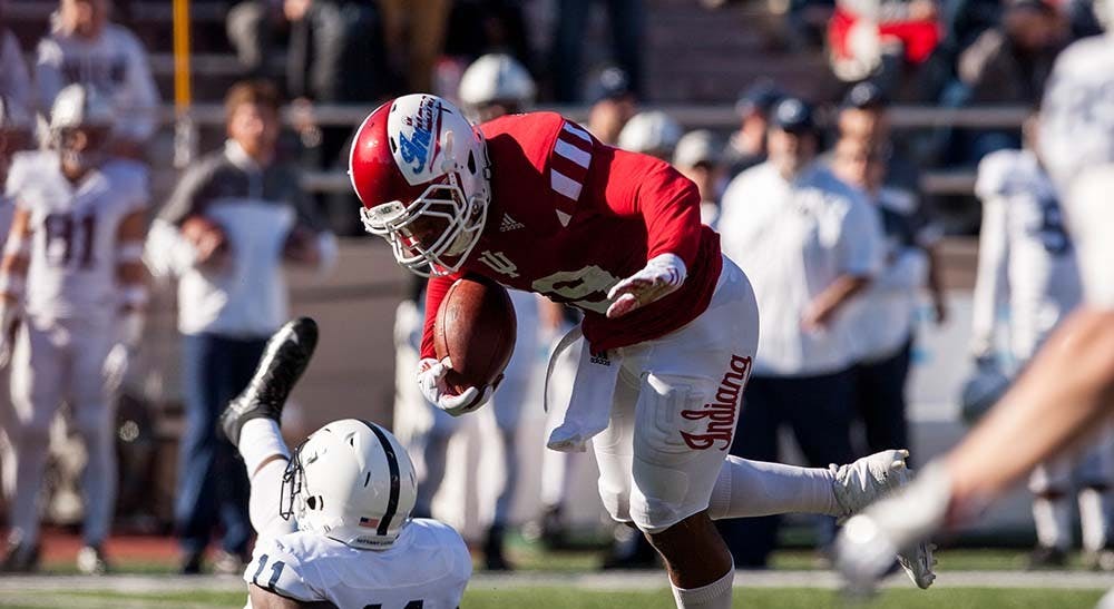 Junior defensive back Tony Fields runs the ball against Penn State during the second half. The Hoosiers lost 45-31 to Penn State Saturday.