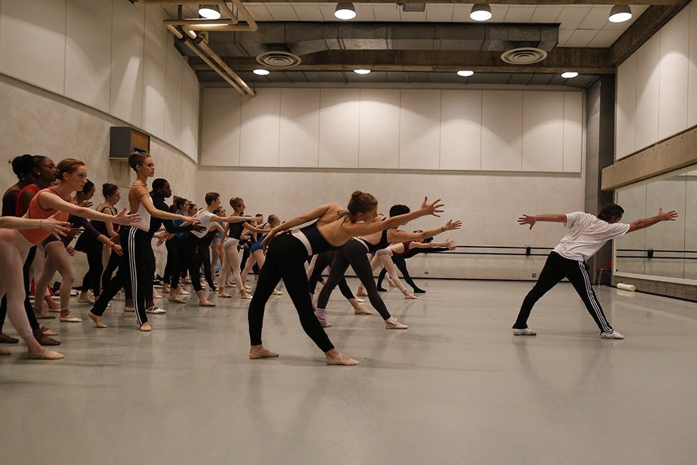 Alex Brady, the company manager for Twlay Tharpe's dancing company, leads a group of IU dance students in dance lesson Tuesday at the Musical Arts Center. Twyla Tharp Dance will be performing tomorrow night at the IU Auditorium. 