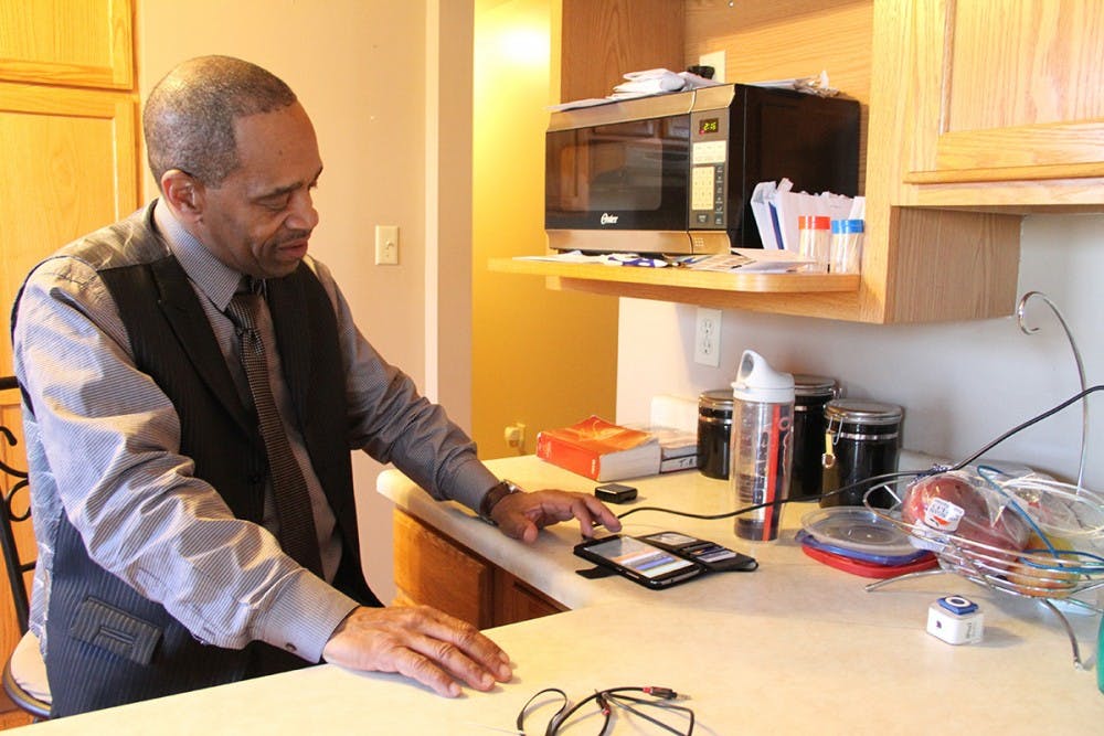 Darryl Pinkins relaxes in his kitchen on a Sunday morning after having breakfast with his son at Cracker Barrel. He shares the house with his nephew, who is a firefighter and is gone for days at a time. Darryl says it's like living alone.