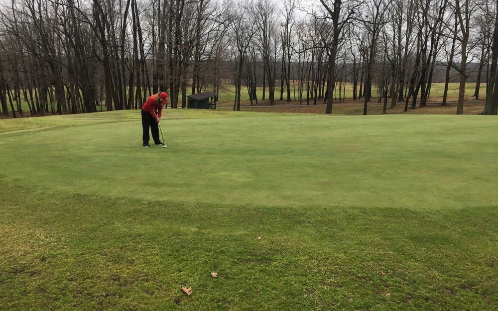 Senior Theresa-Ann&nbsp;Jedra prepares to putt at the Hoosier women's golf&nbsp;practice in Bloomington on Saturday morning. The women will be traveling to Arizona for practice rounds to get used to the arid air and humidity before their first tournaments of the year in the Grand Canyon state.