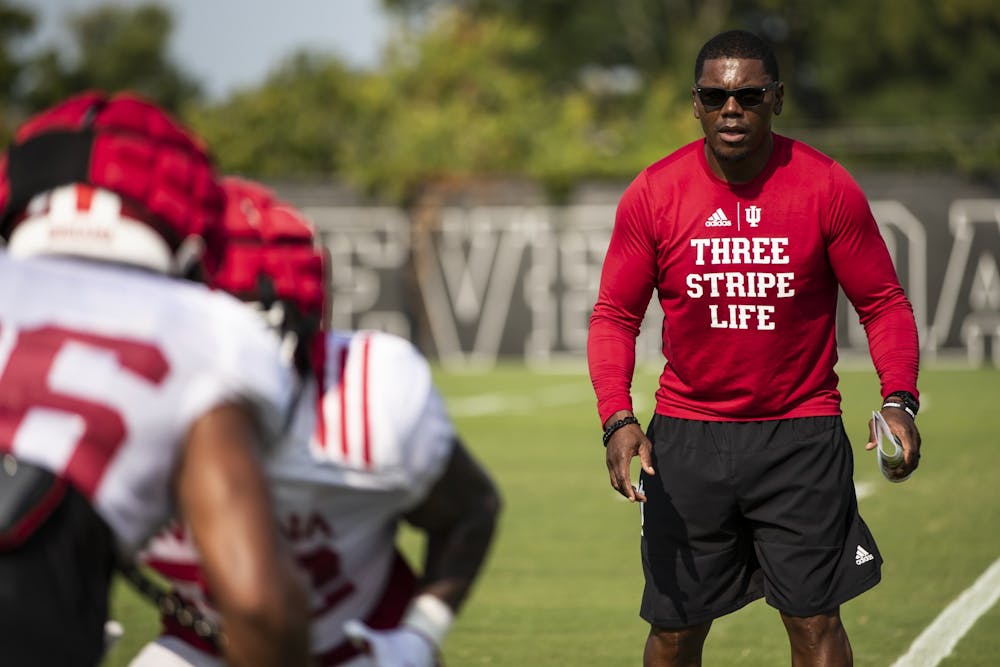 <p>Indiana running backs coach Deland McCullough watches players Aug. 11, 2021, during fall camp at Memorial Stadium in Bloomington. Former Indiana walk-on running back Alex Alex Rodriguez, another former Indiana walk-on who played from 2014-2017, has kept in touch with McCullough, his former coach, since graduation.</p>