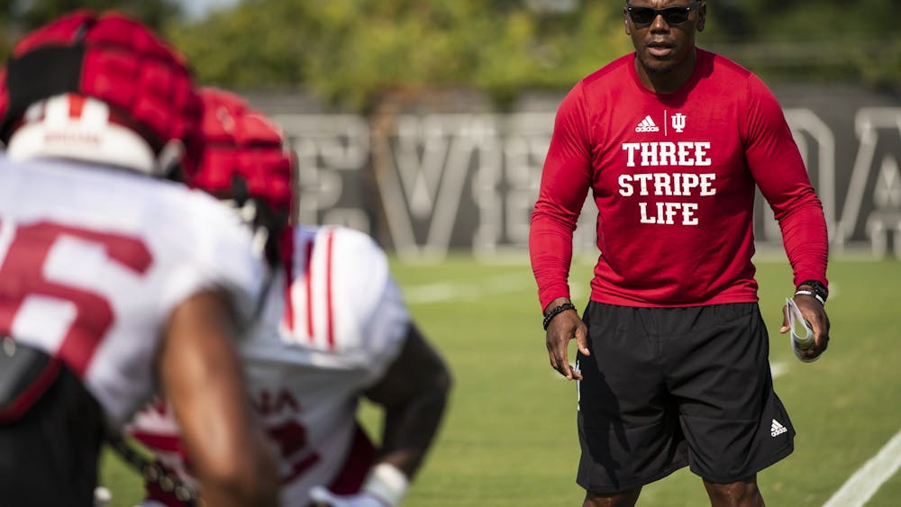 Indiana running backs coach Deland McCullough watches players Aug. 11, 2021, during fall camp at Memorial Stadium in Bloomington. Former Indiana walk-on running back Alex Alex Rodriguez, another former Indiana walk-on who played from 2014-2017, has kept in touch with McCullough, his former coach, since graduation.