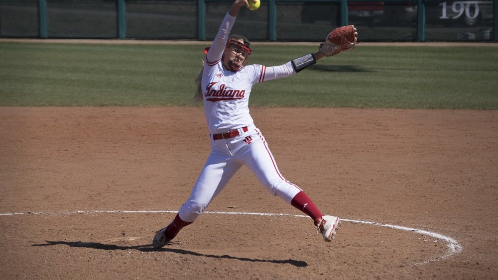 An IU softball team member pitches the ball. The Hoosiers took on the Scarlet Knights last weekend winning two games on Friday but lost on Saturday.