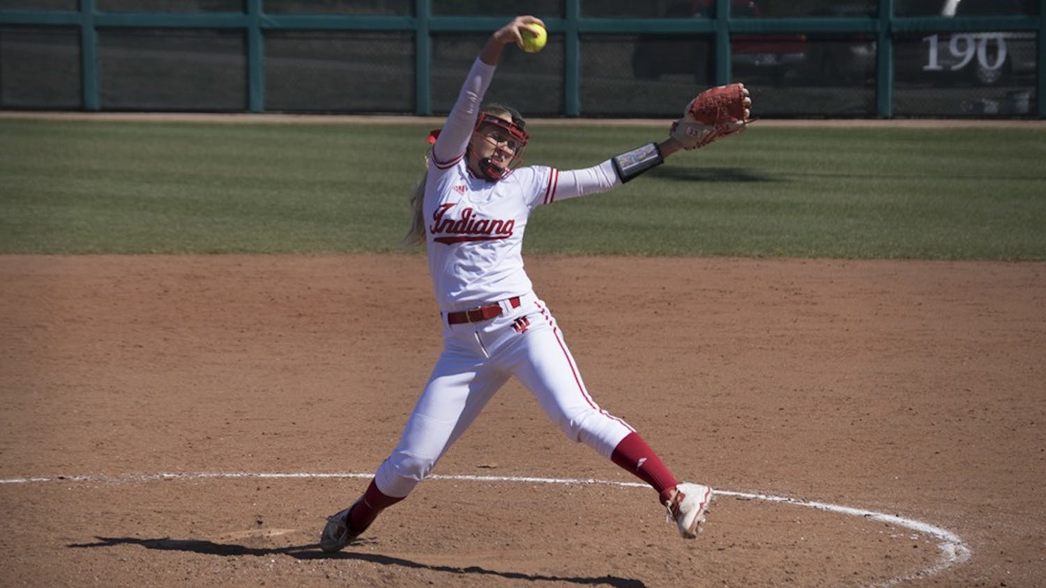 An IU softball team member pitches the ball. The Hoosiers took on the Scarlet Knights last weekend winning two games on Friday but lost on Saturday.