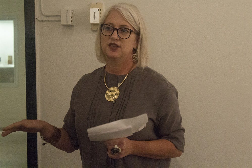 Kelly Richardson, curator of the Sage collection and professor in the School of Apparel Merchandising and Design, gives a lecture discussing Roy Halston Frowick's work o Friday afternoon at Grunwald Gallery. A collection of Halston's work will be in the gallery through October 3.