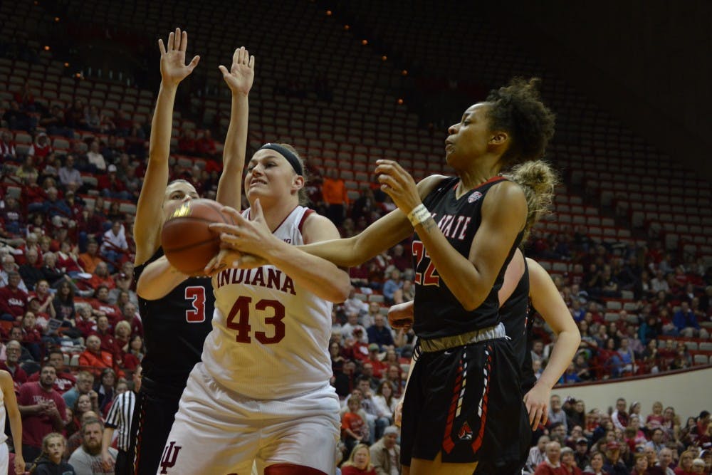 Senior center Jenn Anderson rebounds the ball and goes for a second shot for IU during their game against Ball State Thursday evening. Anderson had two big shots during the game helping IU advance to the second round of the NIT.&nbsp;