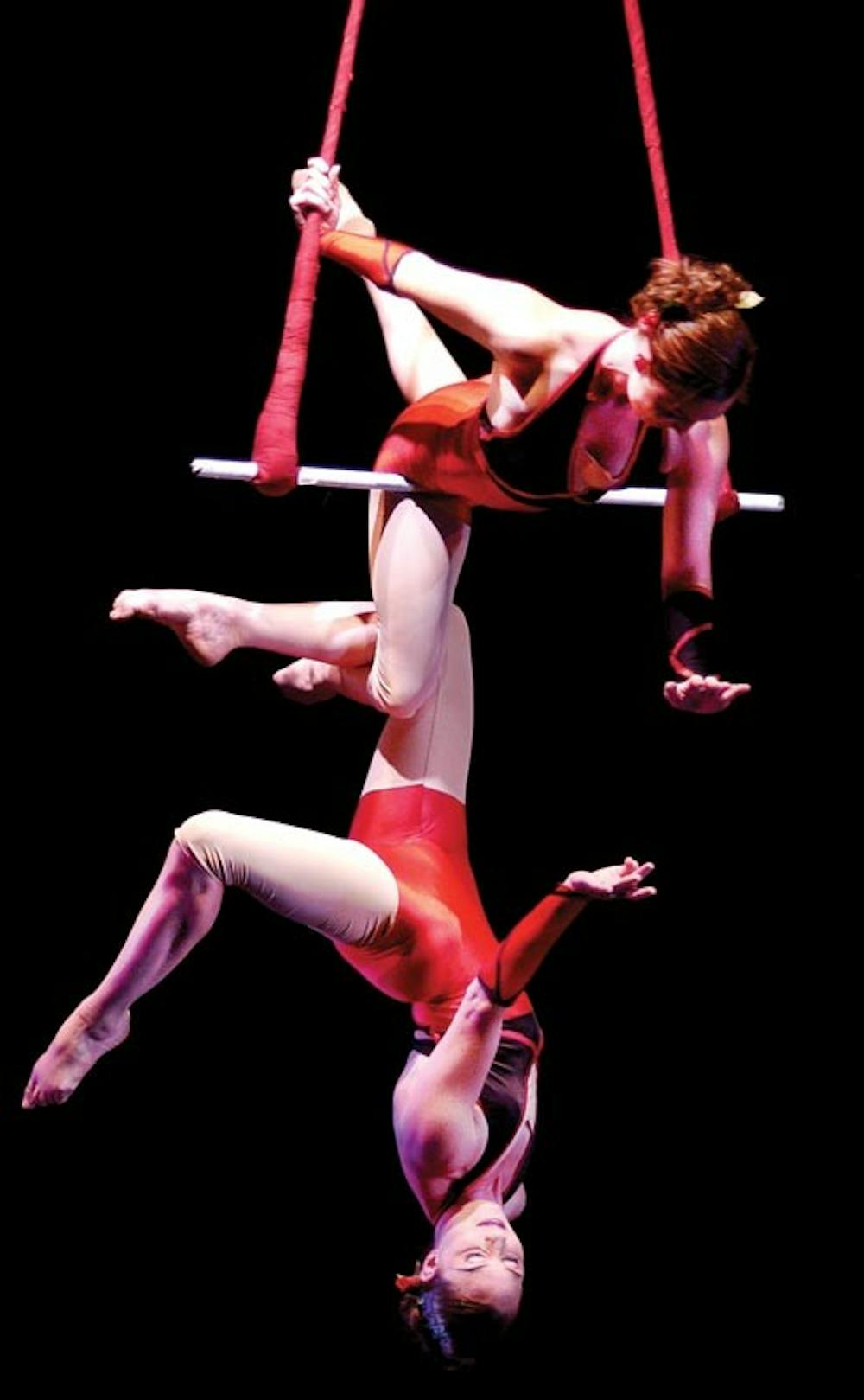COURTESY PHOTOSerenity and Elsie Smith, members of the Colorful Hat Theatrical Circus, perform on the rotating Double Trapeze in this undated photo. The group will be appearing Wednesday, July 24th at the Buskirk-Chumley Theatre.