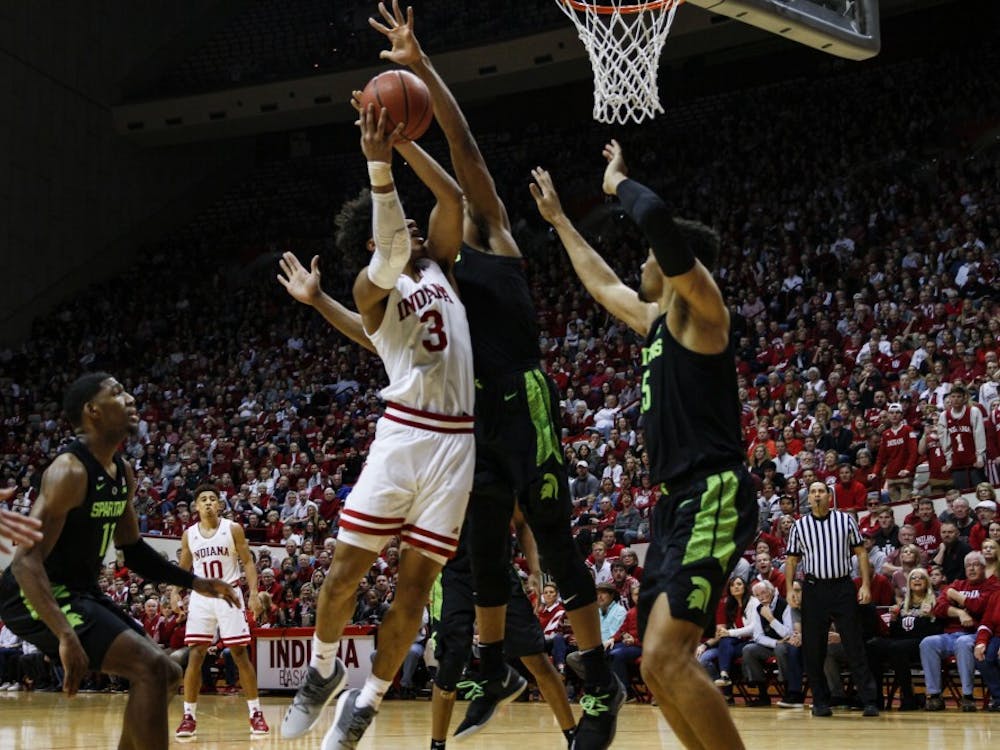 Sophomore forward Justin Smith scores against Michigan State on March 2 at Simon Skjodt Assembly Hall. Smith scored 24 of the 63 points scored and helped IU beat MSU, 63-62.