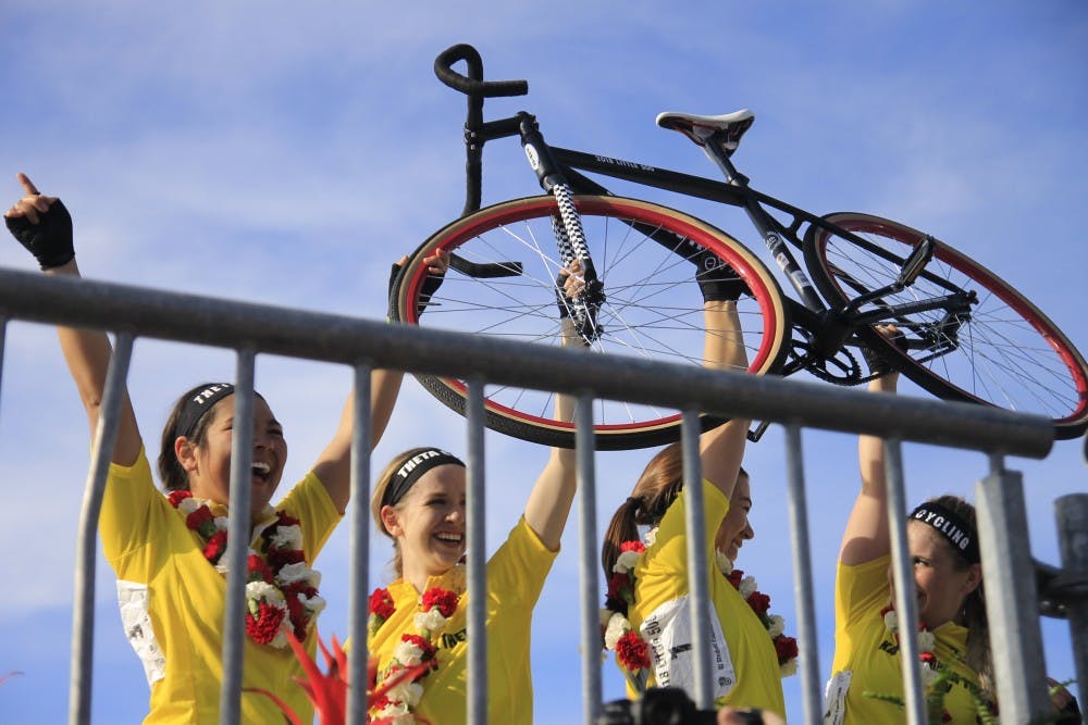 <p>The Kappa Alpha Theta team raises its bike in celebration of its repeat Little 500 win. The women raced April 20.</p>