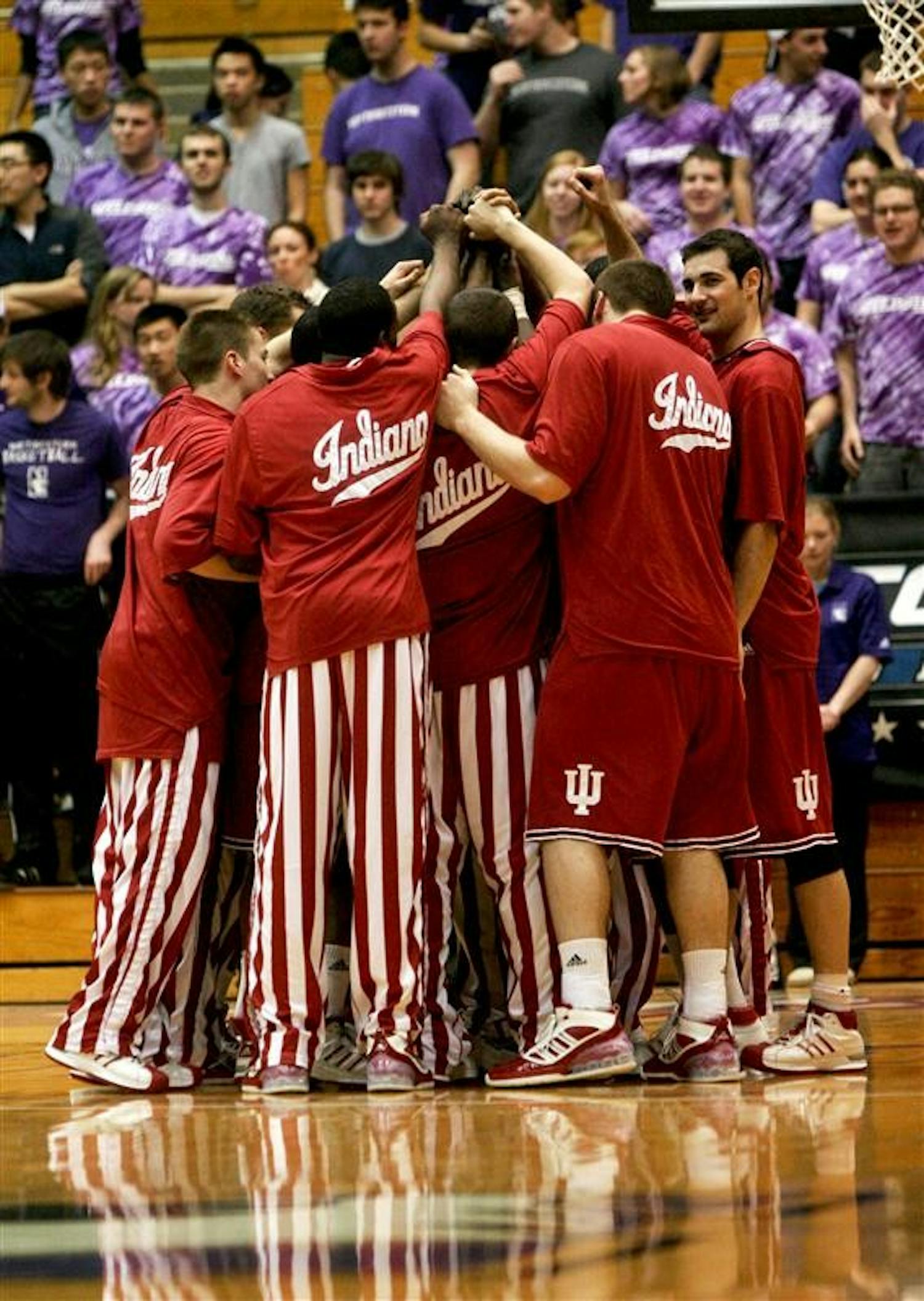 The Hoosiers gather after warmups just before the start of their match with the Northwestern Wildcats in Evanston, Ill.