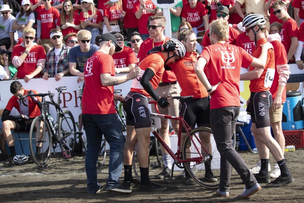 <p>Phi Kappa Psi riders join together after they finish the men’s Little 500 race April 13 at Bill Armstrong Stadium. Although the team was in the lead toward the very end of the race, it earned eighth place after its 199th lap exchange. </p>