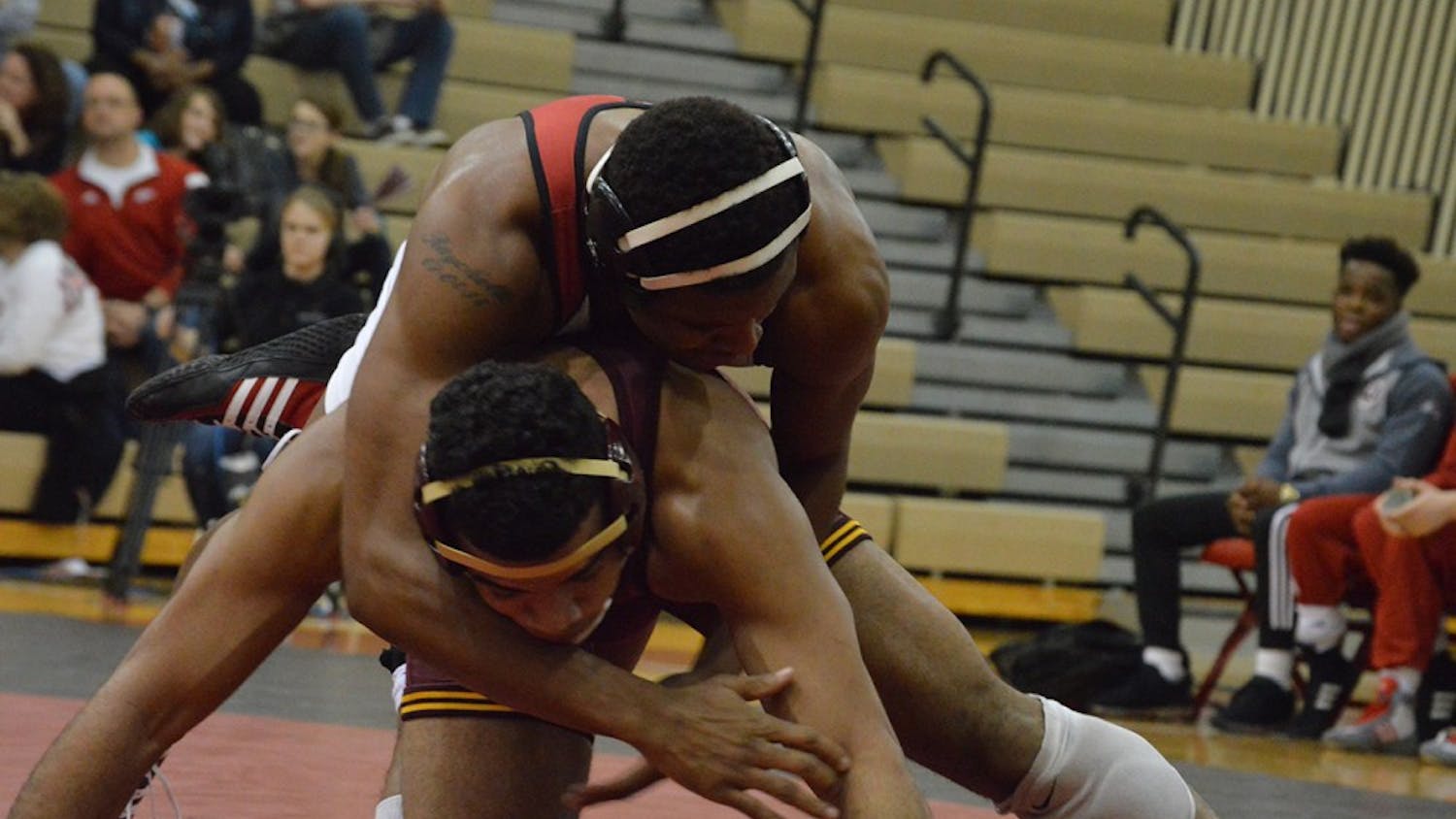 Senior Nate Jackson takes down Minnesota's Robert Stevenson in January in University Gym. Jackson placed eighth at the NCAA Championships and grabbed his second All-America honor this weekend.