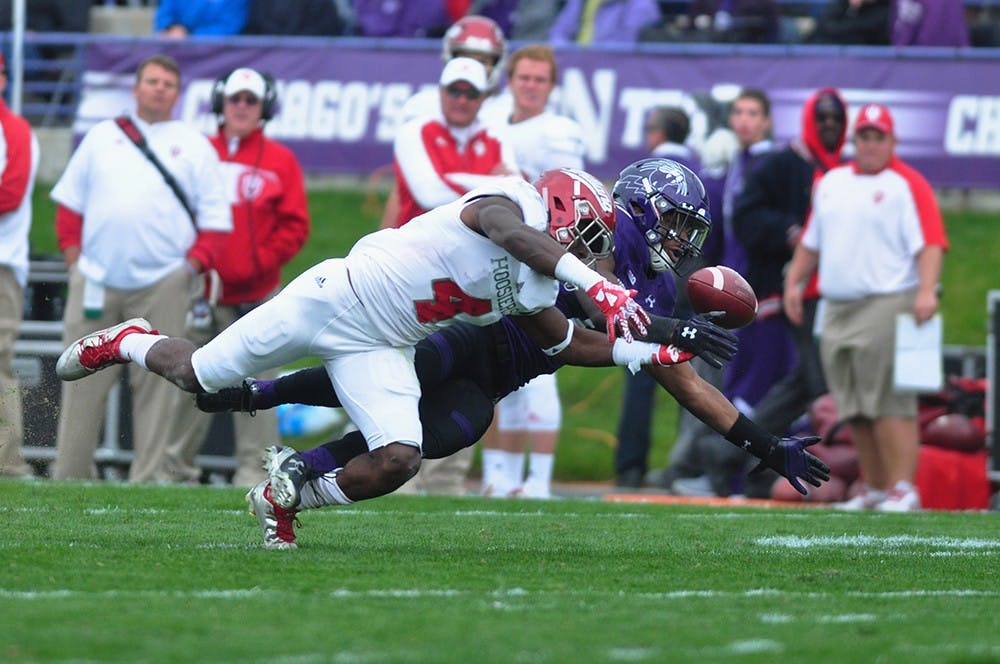 Wide receiver Ricky jones is unable to complete a pass on Saturday at Ryan Field in Evanston, ILL. Indiana lost to Northwestern 24-14.