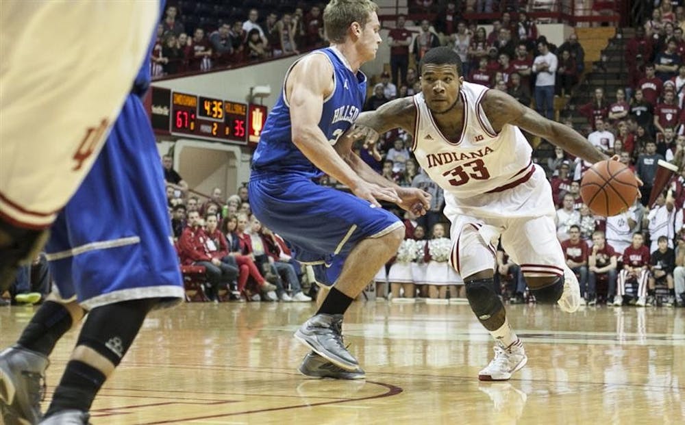 Sophomore Jeremy Hollowell drives the ball past his Hillsdale defender during IU's game Monday at Assembly Hall.