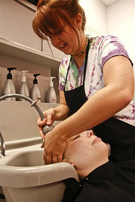 Senior Nicky Pater cuts Poland, Ind., resident Hannah Tincher’s hair Sunday afternoon at Great Clips, 115 S. State Road 46.