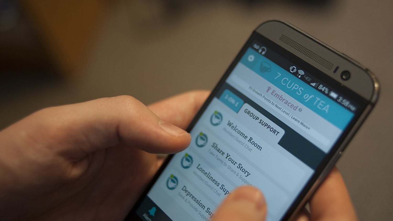 IU Freshman Gary Lei browsing through '7 Cups of Tea' on his smart phone. '7 Cups of Tea' is a phone app available on Android and iPhones. The app functions as a peer support group and users can chat with volunteers on a range of topics including loneliness and depression.