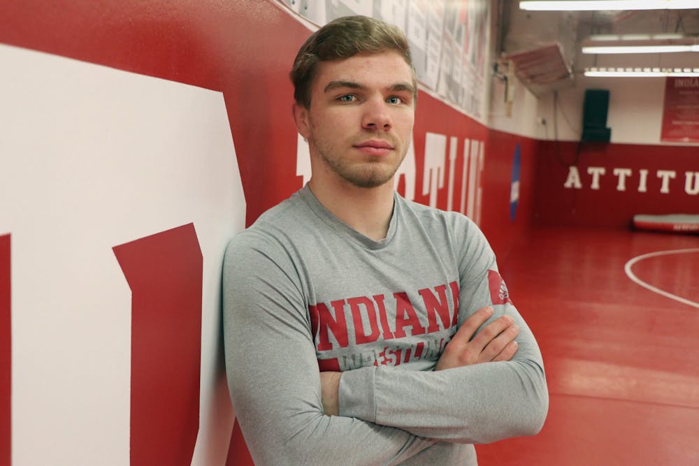 <p>Then-junior Brock Hudkins stands for a headshot in the wrestling practice room in Simon Skjodt Assembly Hall. IU will face Michigan State University on Jan. 17 at Wilkinson Hall. </p>