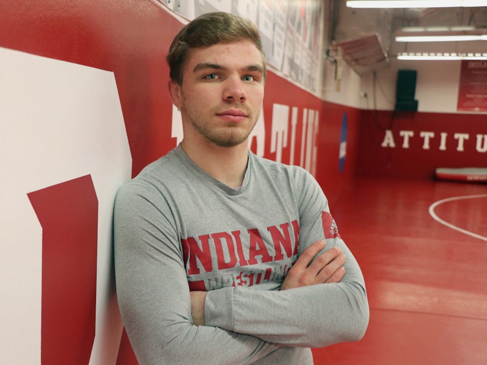 Then-junior Brock Hudkins stands for a headshot in the wrestling practice room in Simon Skjodt Assembly Hall. IU will face Michigan State University on Jan. 17 at Wilkinson Hall. 