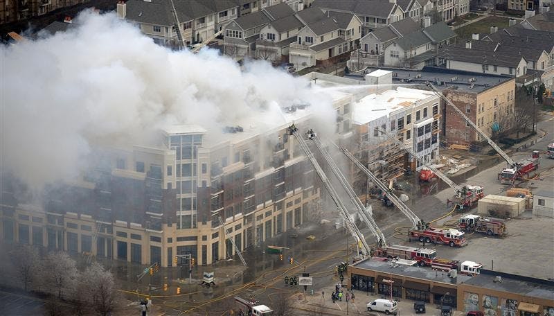 Members of the Indianapolis Fire Department work to put out a large fire at the Cosmopolitan on the Canal complex on March 12 in downtown Indianapolis.