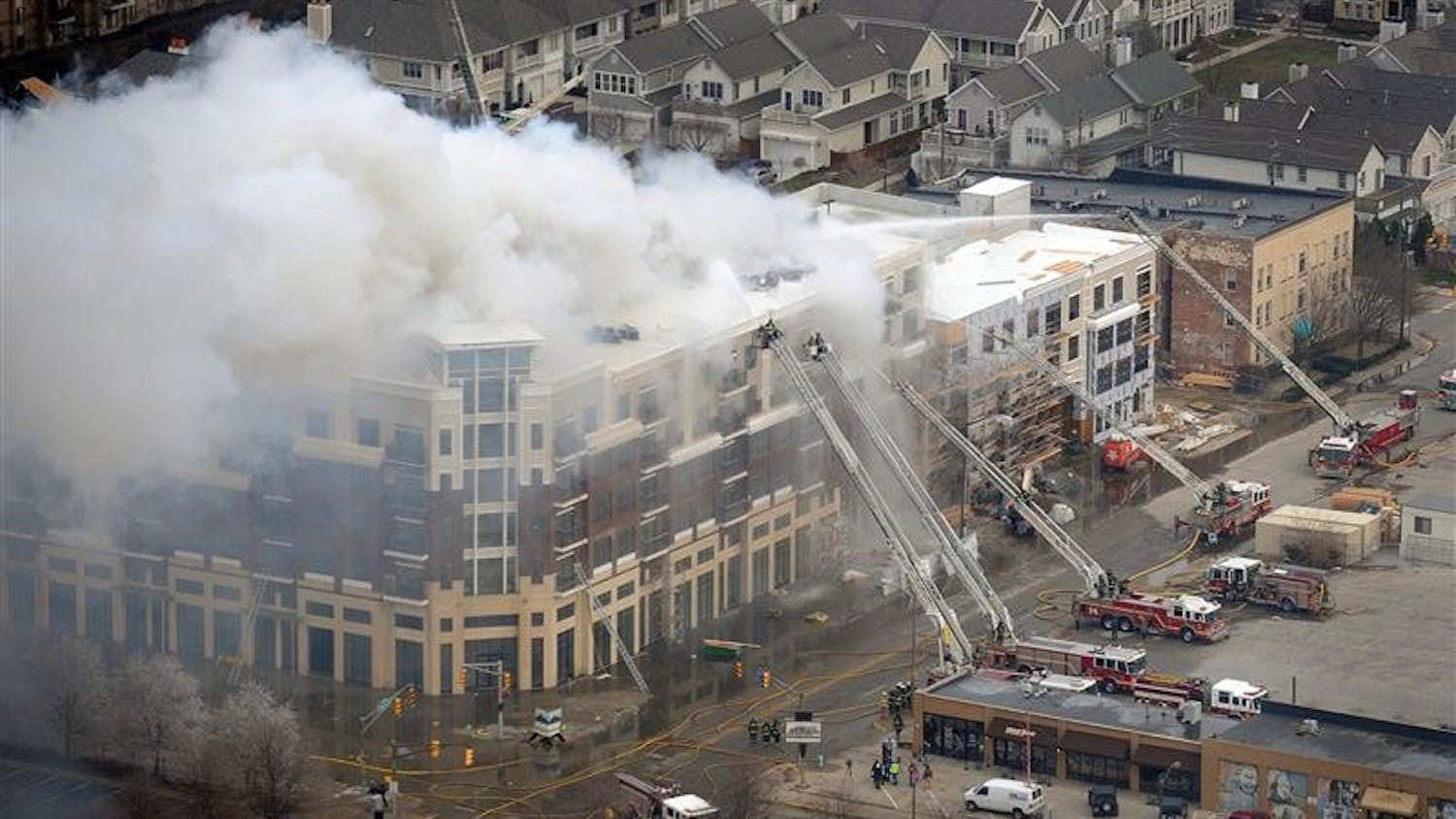 Members of the Indianapolis Fire Department work to put out a large fire at the Cosmopolitan on the Canal complex on March 12 in downtown Indianapolis.
