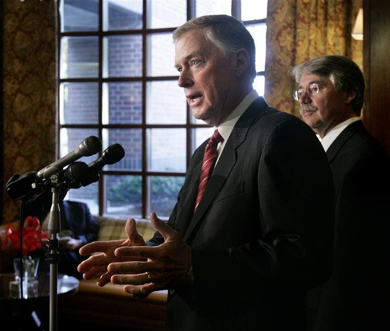 Former Vice President Dan Quayle, left, speaks on behalf of Republican candidate for attorney general, Greg Zoeller, right, at a news conference on Wednesday in Indianapolis.