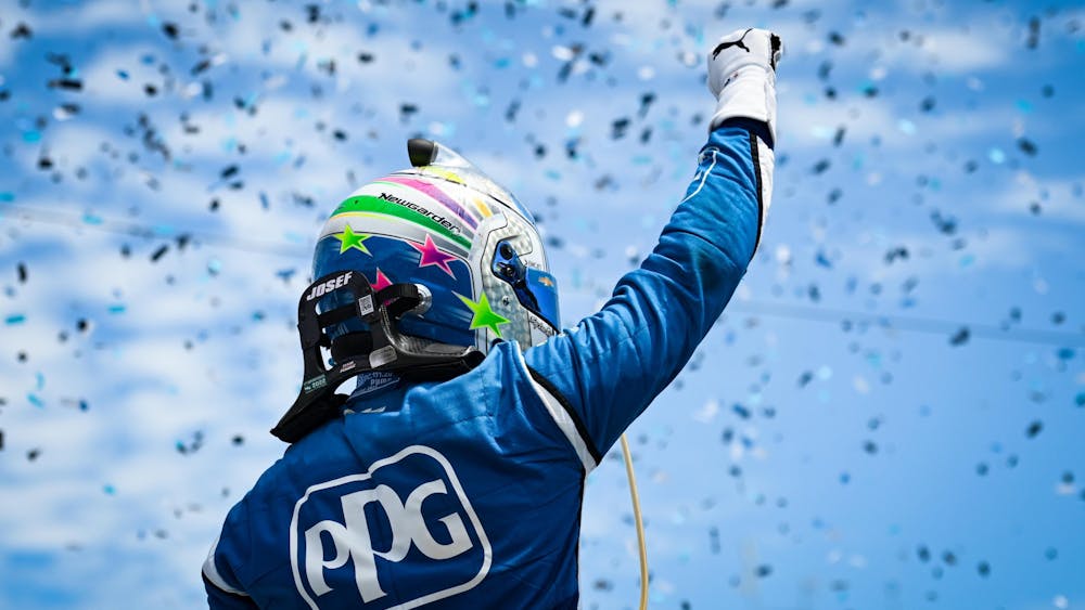 Team Penske’s Josef Newgarden celebrates after winning the Sonsio Grand Prix at Road America on June 12, 2022. With Sunday’s win, Newgarden is the first driver of the season to win on a road course, street circuit and oval track, and will therefore receive the first-ever PeopleReady Force for Good Challenge prize. 