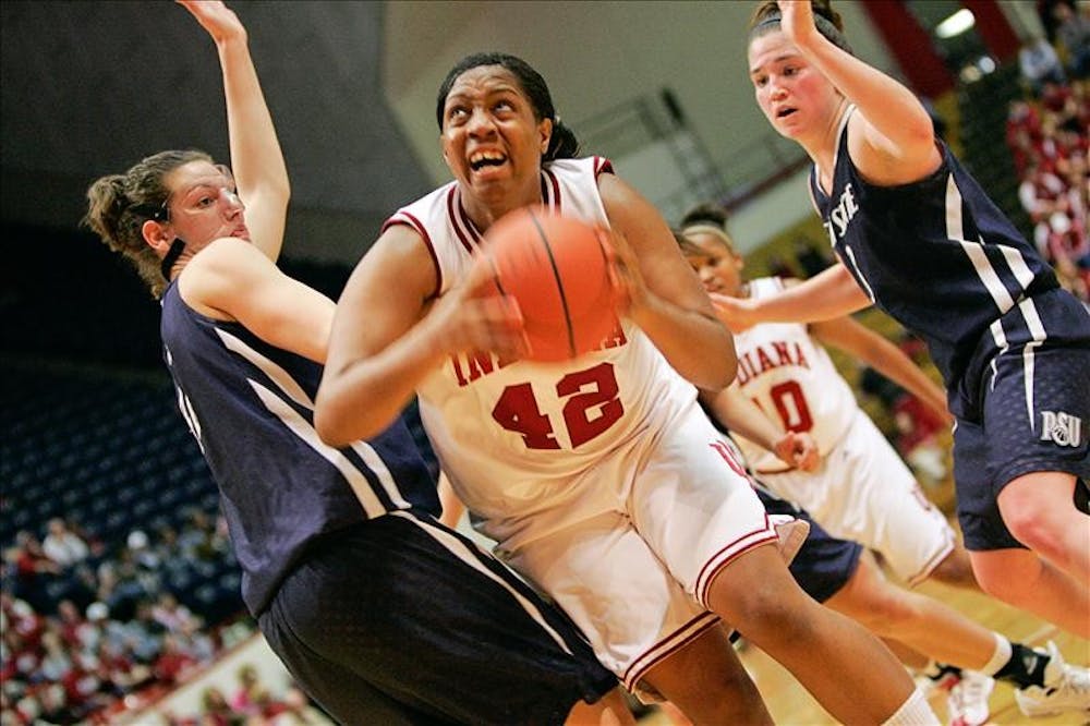 Senior forward Amber Jackson powers through two defenders during the Hoosiers 65-55 win over Penn State Thursday night at Assembly Hall.