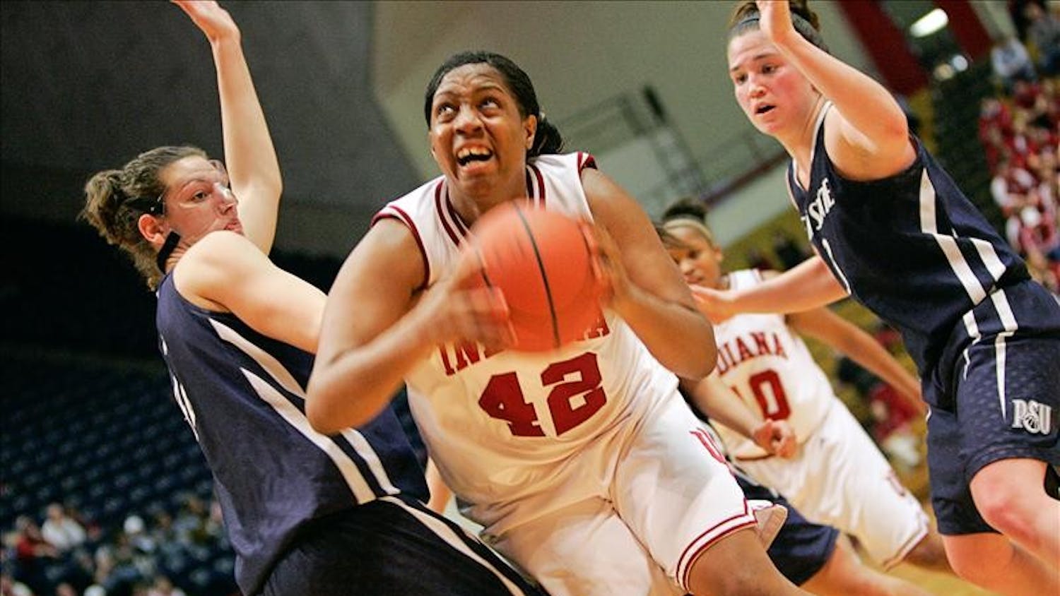 Senior forward Amber Jackson powers through two defenders during the Hoosiers 65-55 win over Penn State Thursday night at Assembly Hall.