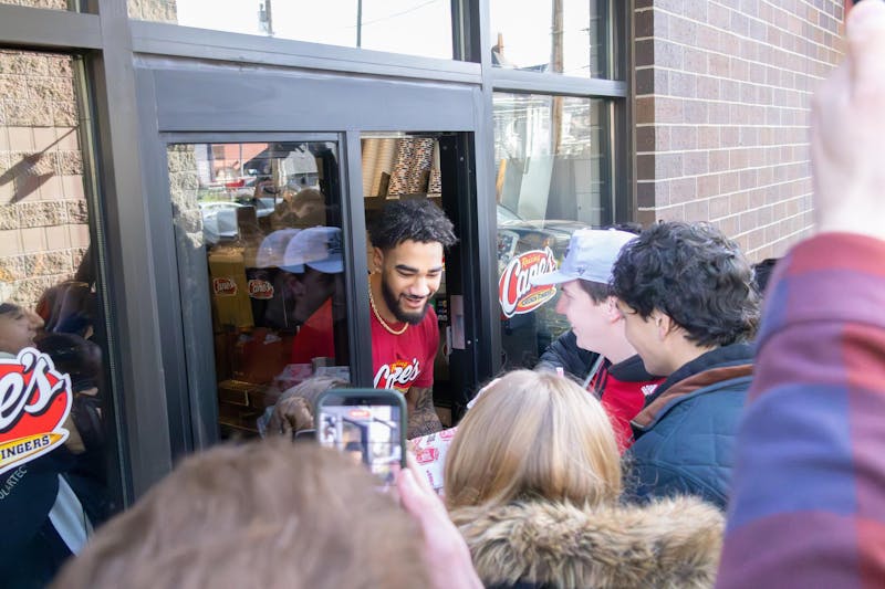 Indiana football players connect with fans while ‘employed’ at Raising Cane’s Chicken Fingers