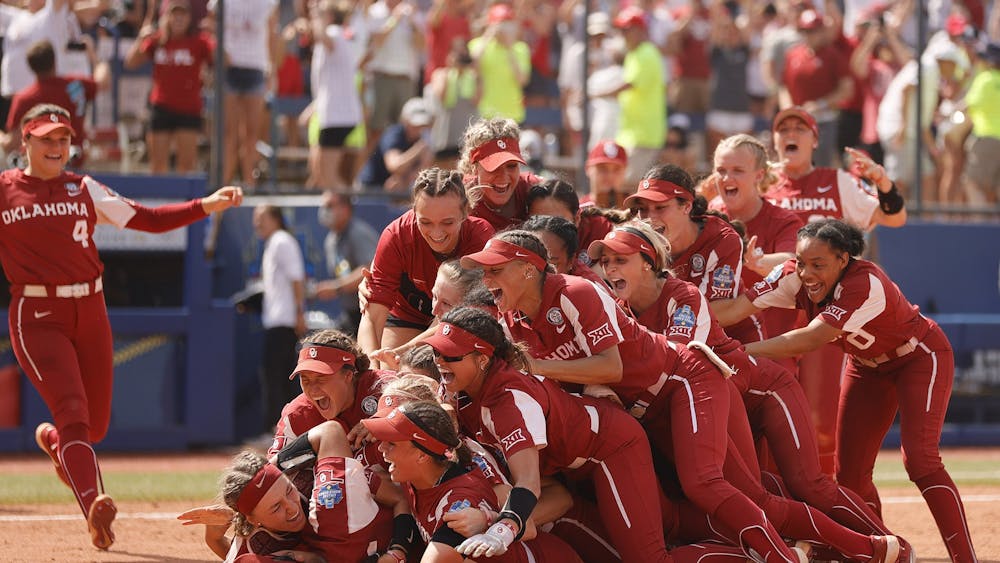 The Oklahoma Sooners dog pile on Giselle Juarez (45) after she pitched the final out to win Game 3 of the Women's College World Series Championship against the Florida St. Seminoles at USA Softball Hall of Fame Stadium on June 10, 2021 in Oklahoma City, Oklahoma. The Oklahoma Sooners won 5-1. 