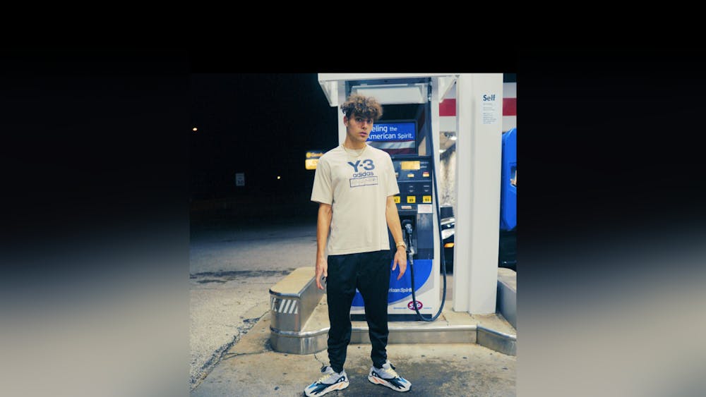 Bloomington native Braydon “Brayke&#x27;&#x27; Elgar poses for a photo in front of a gas pump. In 2021, a producer reached out to Elgar on social media giving him the opportunity to star in season two of HBO Max’s reality dating show “FBOY Island.” 