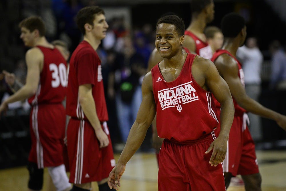 Junior guard Kevin "Yogi" Ferrell laughs after breaking from a huddle during practice Thursday at CenturyLink Center in Omaha, Neb.