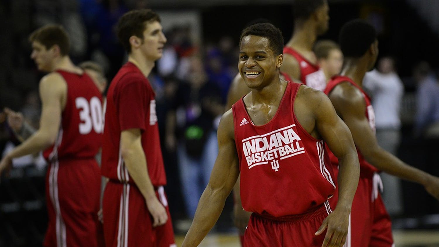 Junior guard Kevin "Yogi" Ferrell laughs after breaking from a huddle during practice Thursday at CenturyLink Center in Omaha, Neb.