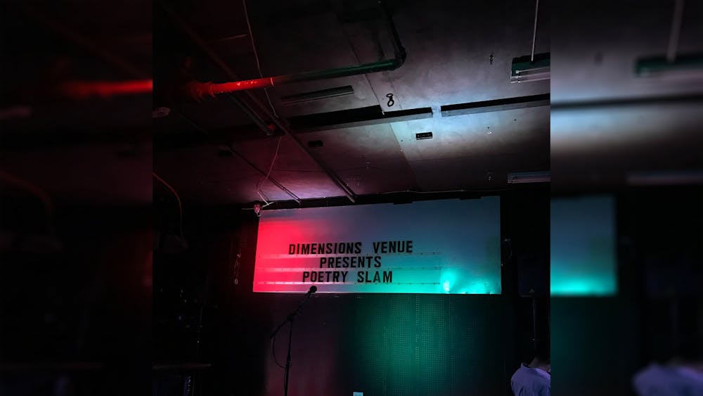 The stage at the Artisan Alleys’  Dimensions Gallery where poets performed on July 29. Bloomington arts nonprofit Artisan Alley hosted a poetry slam highlighting poetry about the COVID-19 pandemic Thursday night. 