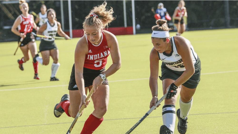 Then-freshman forward Hailey Couch keeps the ball away from a Michigan State defender Oct. 5, 2018, at the IU Field Hockey Complex. The IU field hockey team opens its 20th season facing the University of Louisville and Drexel University this weekend. 