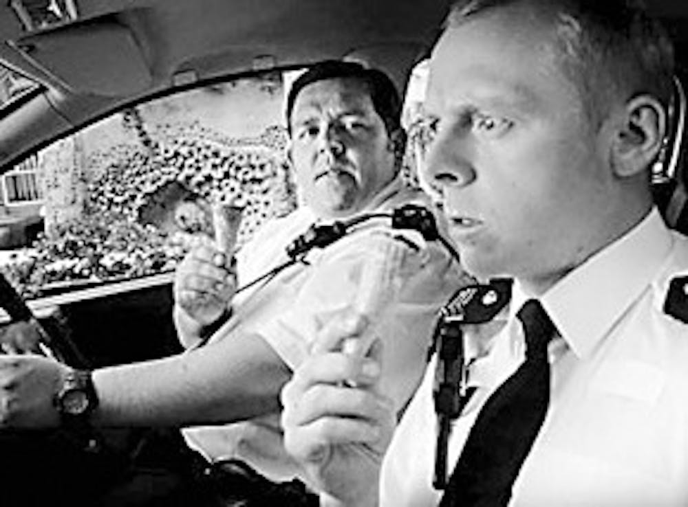Simon Pegg and Nick Frost enjoy a tasty treat together. Hey it beats being eaten by zombies.