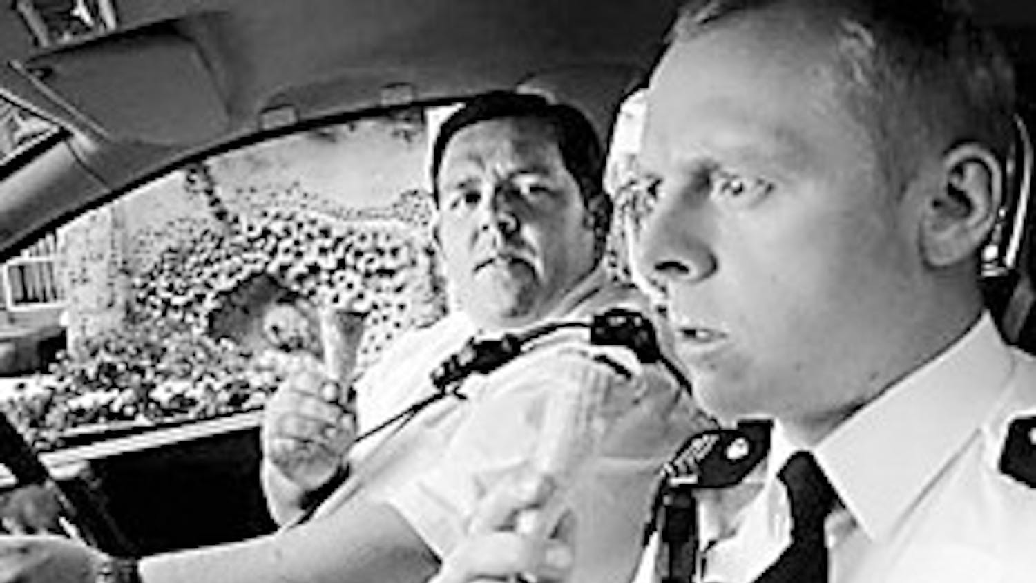 Simon Pegg and Nick Frost enjoy a tasty treat together. Hey it beats being eaten by zombies.