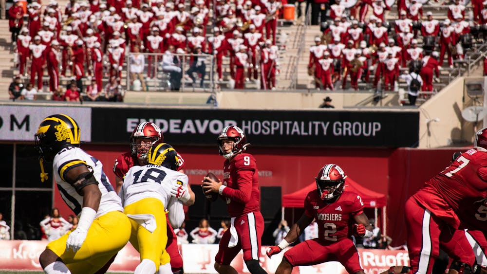 Redshirt junior quarterback Connor Bazelak looks for an opening to throw the ball during the second quarter Oct. 8, 2022, at Memorial Stadium. Indiana lost against Michigan 31-10. 