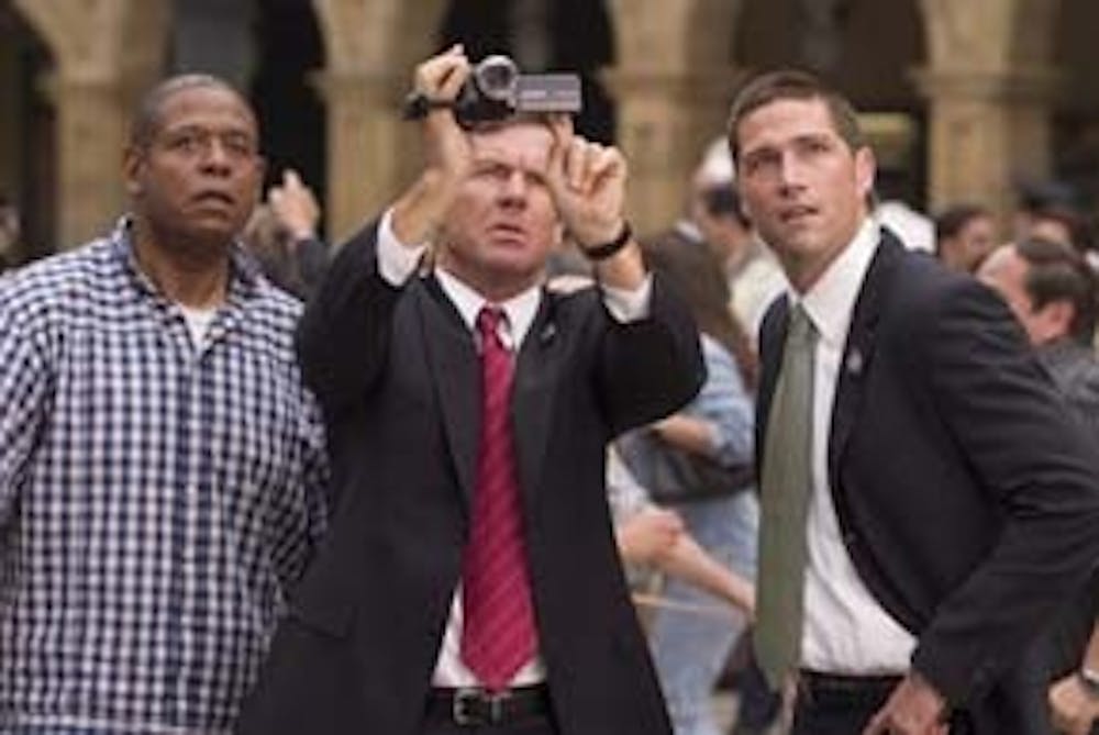 Secret Service Agents Thomas Barnes (Dennis Quaid, center) and Kent Taylor (Matthew Fox, right) look at video footage shot by an American tourist, Howard Lewis (Forest Whitaker, left), in Columbia Pictures