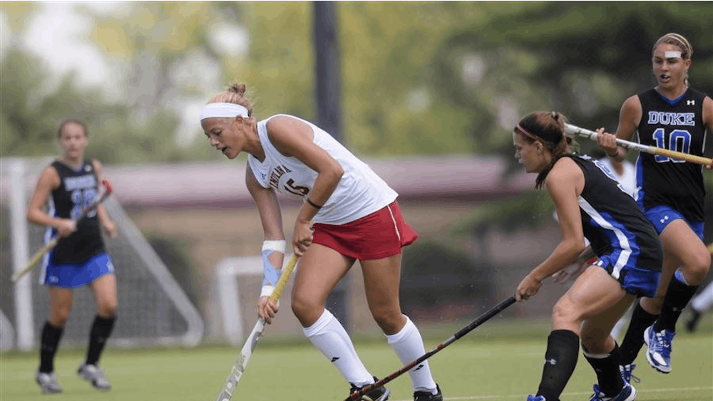 Sophomore defender Hannah Boyer attempts to prevent Duke from taking possesion of the ball during the Hoosier's match against the Blue Devils on Sunday at the IU Field Hockey Complex. 
