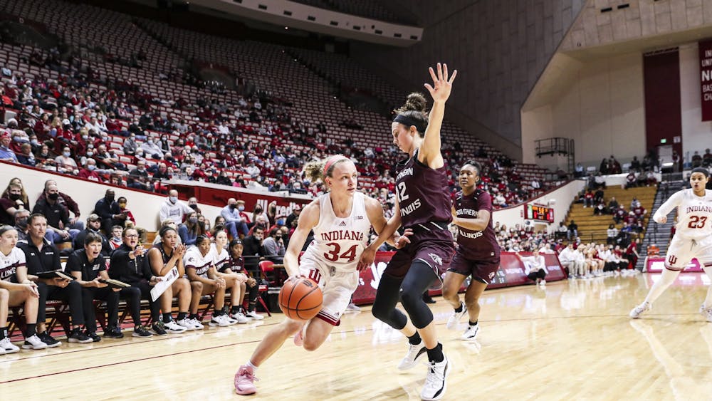 Senior guard Grace Berger drives to the basket against Southern Illinois University on Thursday at Simon Skjodt Assembly Hall. Berger finished with 18 points for Indiana women's basketball to extend its win streak to five games.