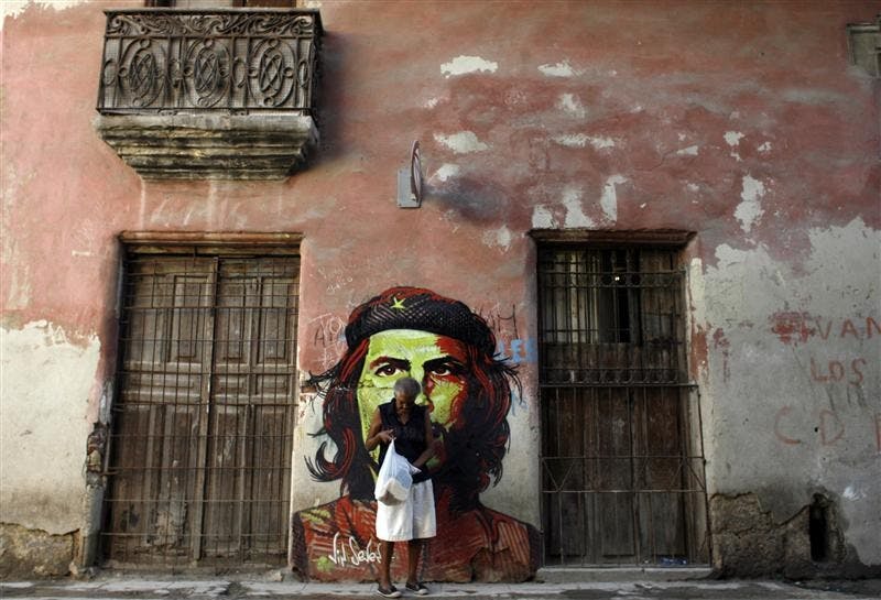 REVOLUTION – A woman walks past a graffiti depicting Argentine-born revolutionary hero Ernesto “Che” Guevara on Wednesday in Havana. Cuba marks the 41st anniversary of “Che” Guevara’s death on Oct. 8, although he was killed on Oct. 9, 1967, in the town of La Higuera, Bolivia. 