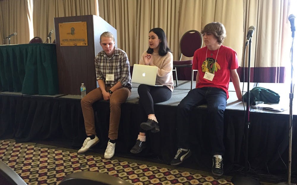 Chief engineer and sophomore Nick Kinney, B-Side programing director and junior Dalia Erkman, and general manager and senior Michael Henderson have a discussion at the Intercollegiate Broadcasting System conference in New York City about WIUX's B-Side program. B-Side is an online-only station that WIUX created to allow more students to become radio DJs.