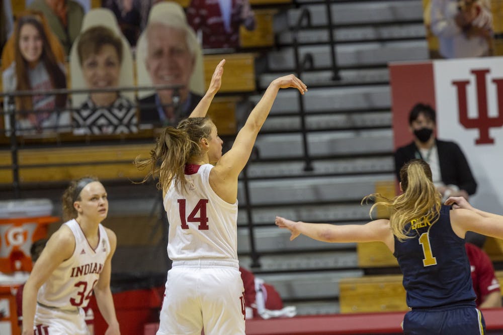 Senior guard Ali Patberg follows through her shot Thursday in Simon Skjodt Assembly Hall. No. 14 IU defeated No. 11 Michigan 70-65, led by Patberg's team-high 21 points.