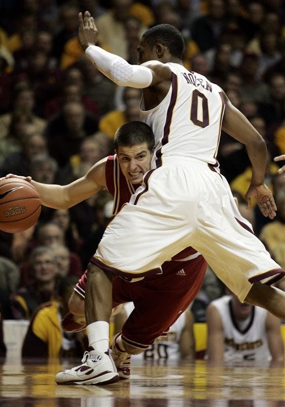 Indiana guard Daniel Moore (3) drives under the basket against Minnesota guard Al Nolen (0) during the first half Tuesday in Minneapolis.