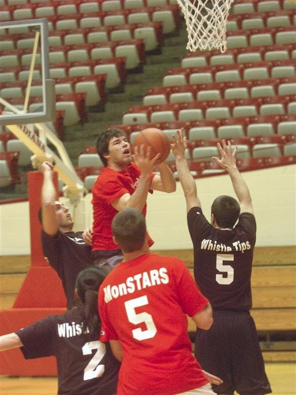 The Co-ed Whistle Tips, wearing black, face the MonSTARS, wearing red, Thursday evening at Assembly Hall. The MonSTARS went on to win 49-44.