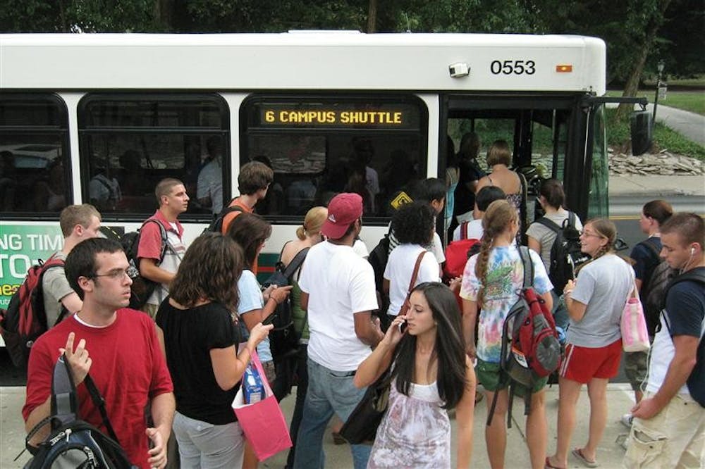 Students wait in line for campus bus services on Sept. 3 at Wells Library.