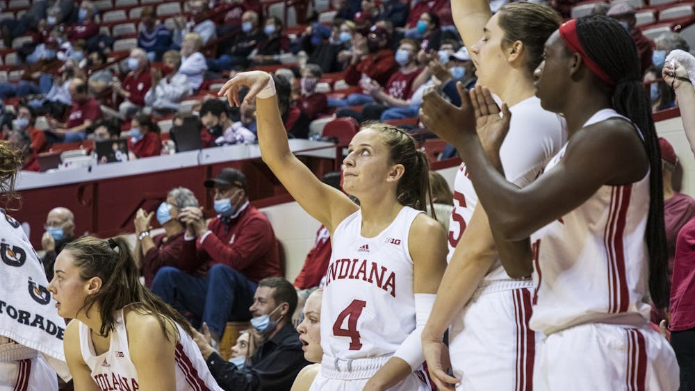 Graduate guard Nicole Cardaño-Hillary celebrates her teammate&#x27;s jumpshot Dec. 9, 2021, at Simon Skjodt Assembly Hall. IU defeated Wisconsin 76-53 on Wednesday.