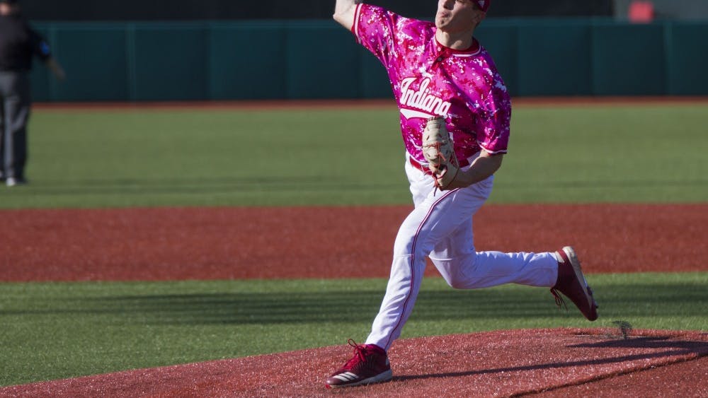 Starting pitcher junior Jonathan Stiever pitches during IU's game against Illinois on April 27. Stiever signed with the Chicago White Sox Monday.