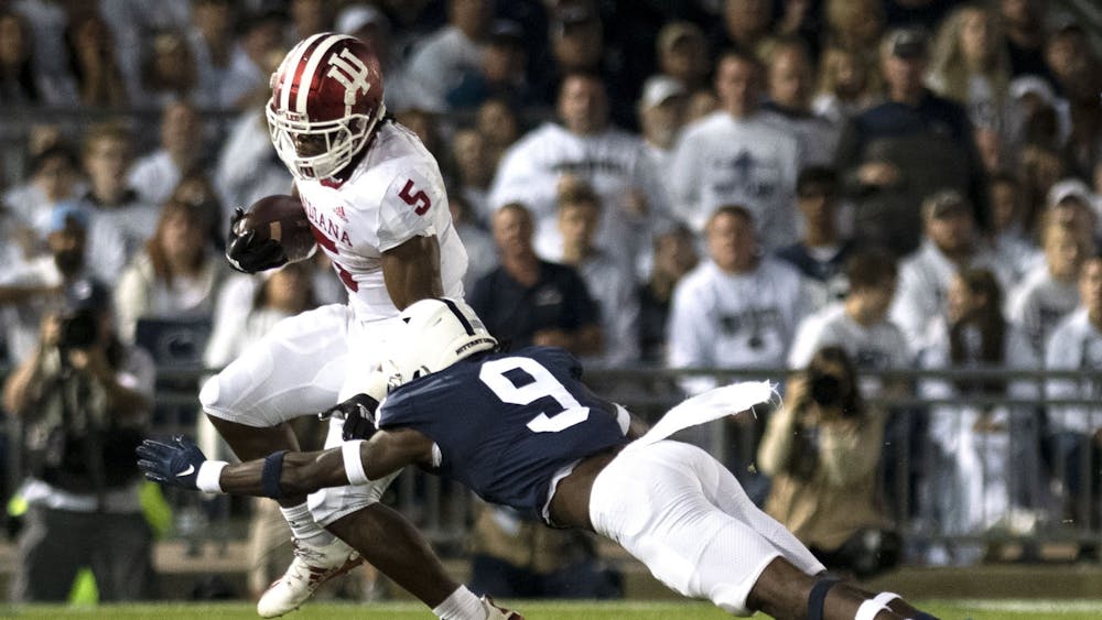 Graduate running back Stephen Carr attempts to elude a tackler against Penn State on Oct. 2, 2021, at Beaver Stadium. Indiana has a bye this week.